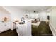 Contemporary kitchen featuring white cabinetry, granite countertops, and open access to the living space at 2027 Lois Pl, Atlanta, GA 30318