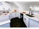 Bright kitchen featuring white cabinets, quartz countertops, and modern fixtures at 2027 Lois Pl, Atlanta, GA 30318