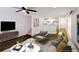 Inviting living room with an open layout, modern decor, and hardwood floors, perfect for relaxation and entertaining at 2027 Lois Pl, Atlanta, GA 30318