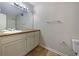 Bathroom featuring a wide mirror, neutral tile, and vanity at 110 Silverthorne Dr, Douglasville, GA 30134