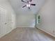Spacious carpeted bedroom has a ceiling fan and natural light from the window at 110 Silverthorne Dr, Douglasville, GA 30134