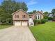 Charming split-level home featuring a two-car garage, front yard, and inviting entrance at 110 Silverthorne Dr, Douglasville, GA 30134