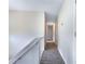 Upstairs hallway offers neutral carpet and paint at 110 Silverthorne Dr, Douglasville, GA 30134