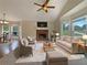 Bright, staged living room with fireplace, large windows, and comfortable seating arrangement at 110 Silverthorne Dr, Douglasville, GA 30134