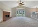 Bright and airy living room featuring a cozy fireplace and a large bay window at 110 Silverthorne Dr, Douglasville, GA 30134