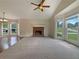 Spacious living room featuring a brick fireplace and large windows providing ample natural light at 110 Silverthorne Dr, Douglasville, GA 30134