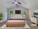 Bright staged main bedroom features a comfortable bed, modern decor, and ample natural light at 110 Silverthorne Dr, Douglasville, GA 30134