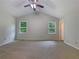 Spacious main bedroom offers natural light, neutral walls, and plush carpeting at 110 Silverthorne Dr, Douglasville, GA 30134