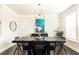Dining room featuring modern chandelier, art piece, and modern black table and chairs at 3133 Quinn Pl, Atlanta, GA 30341