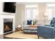 Inviting living room with a fireplace, large windows, and comfortable seating arrangement at 3133 Quinn Pl, Atlanta, GA 30341