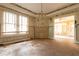 Living room features large windows, a fireplace, and an open doorway to another room at 969 Byron Sw Dr, Atlanta, GA 30310