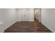 Finished basement space featuring wood-look floors, offering versatility and room to customize at 10650 Centennial Dr, Alpharetta, GA 30022