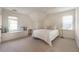 Bright bedroom featuring a window seat, neutral colors and plush carpet at 10650 Centennial Dr, Alpharetta, GA 30022