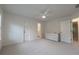 Neutral bedroom with carpeted floors, ceiling fan and plenty of natural light at 10650 Centennial Dr, Alpharetta, GA 30022