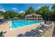 Large community pool area with plenty of lounge chairs and shaded seating for relaxing at 10650 Centennial Dr, Alpharetta, GA 30022