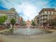 Beautiful fountain in a town center surrounded by shops, restaurants, and residential buildings at 10650 Centennial Dr, Alpharetta, GA 30022
