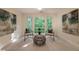 Bright sitting area featuring neutral colors and large window overlooking greenery at 10650 Centennial Dr, Alpharetta, GA 30022