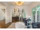 Comfortable sitting room with large windows, plush seating, and modern chandelier with a beautiful view at 10650 Centennial Dr, Alpharetta, GA 30022