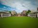 Town center featuring a large green space surrounded by upscale buildings and businesses at 10650 Centennial Dr, Alpharetta, GA 30022
