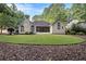 Well-maintained backyard featuring a lush green lawn and mature trees, perfect for outdoor activities at 2525 Fairview Dr, Cumming, GA 30041