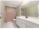 This bathroom features a single sink, cream color and a shower with a tan curtain at 2525 Fairview Dr, Cumming, GA 30041