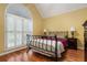 Bedroom features hardwood floors, a large window and ample light at 2525 Fairview Dr, Cumming, GA 30041