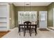 Charming dining area with a wooden table and ample natural light at 2525 Fairview Dr, Cumming, GA 30041