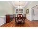 Elegant dining room featuring hardwood floors, tray ceiling, and a chandelier at 2525 Fairview Dr, Cumming, GA 30041