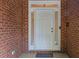 Front door framed by sidelights and brick, providing a secure entrance at 2525 Fairview Dr, Cumming, GA 30041