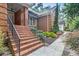 Brick stairs leading to the front entrance, surrounded by landscaped greenery at 2525 Fairview Dr, Cumming, GA 30041