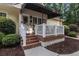 Cozy front porch with seating area and landscaped surroundings at 2525 Fairview Dr, Cumming, GA 30041
