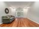 Bright living room features hardwood floors, large windows, and neutral paint at 2525 Fairview Dr, Cumming, GA 30041