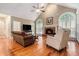 Inviting living room with vaulted ceilings, fireplace, and ample natural light at 2525 Fairview Dr, Cumming, GA 30041