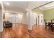 Open-concept space with hardwood floors connecting the living and dining areas at 2525 Fairview Dr, Cumming, GA 30041