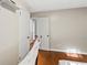 Neutral bedroom with hardwood floors and a closet at 6719 Sunset Valley Cir, Rex, GA 30273