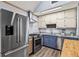 Updated kitchen with stainless steel appliances, including a refrigerator, oven, and dishwasher with granite countertops at 6719 Sunset Valley Cir, Rex, GA 30273