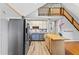 Charming kitchen featuring stainless steel appliances, butcher block island, and open floor plan to the living area at 6719 Sunset Valley Cir, Rex, GA 30273