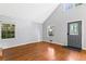 Light-filled living room featuring hardwood floors, large windows, and open layout at 6719 Sunset Valley Cir, Rex, GA 30273