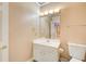 Powder room featuring a sink, vanity with good lighting and decor in neutral tones at 1350 Whitley Rd, Dacula, GA 30019