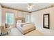 A cozy bedroom boasts a large window and comfortable decor at 1350 Whitley Rd, Dacula, GA 30019