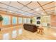 Bright living room boasts hardwood floors, a fireplace with shelving, and abundant natural light at 1350 Whitley Rd, Dacula, GA 30019