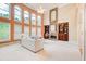 Bright living room with soaring windows, fireplace, and custom built-ins at 1350 Whitley Rd, Dacula, GA 30019