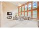 Open living room with soaring windows, comfortable seating, and artwork at 1350 Whitley Rd, Dacula, GA 30019
