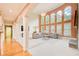 Expansive living room with soaring ceilings, a wall of windows, and a cozy fireplace at 1350 Whitley Rd, Dacula, GA 30019