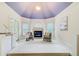 Sitting area with cozy fireplace, lots of windows, and views at 1350 Whitley Rd, Dacula, GA 30019