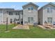 Backyard view of a home with a patio and green grass at 2284 Nicole Dr, Hampton, GA 30228