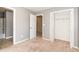 Bedroom featuring neutral walls, carpet, walk in closet and access to the bathroom at 2284 Nicole Dr, Hampton, GA 30228