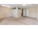 Spacious finished basement with neutral carpeting and built-in shelving at 2284 Nicole Dr, Hampton, GA 30228
