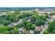 An aerial shot of a neighborhood with the featured house surrounded by green trees at 935 Pelham Nw St, Atlanta, GA 30318