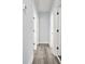 Hallway with hardwood floors and doors to bedrooms and bathrooms at 935 Pelham Nw St, Atlanta, GA 30318